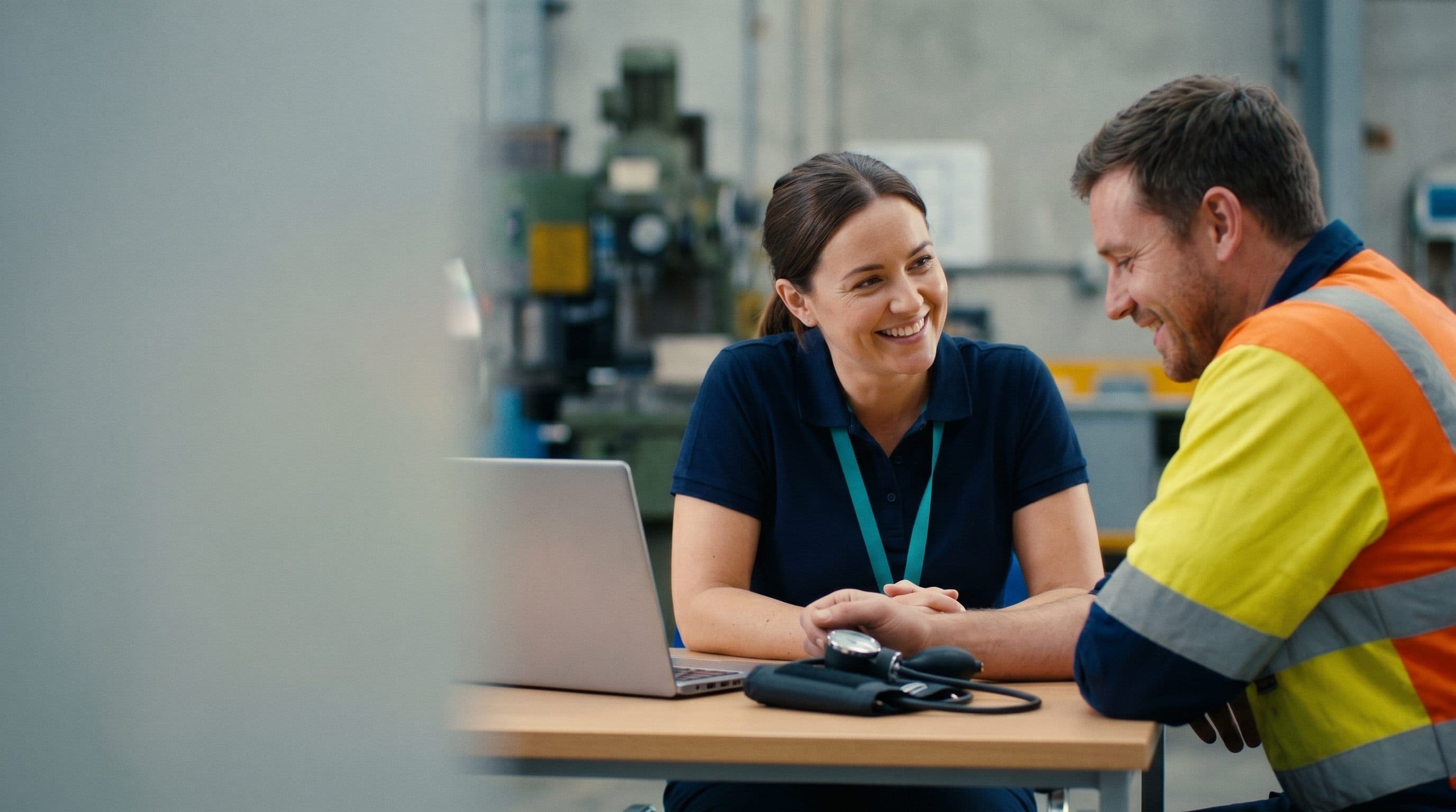 A Healthbox clinician takes a blood pressure reading with an employee at his workplace